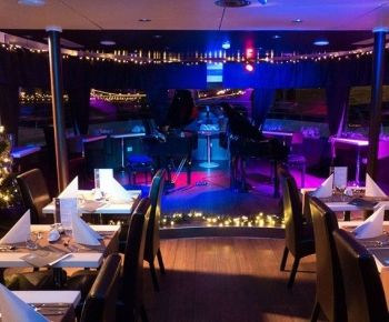 Christmas dinner cruise with piano battle show